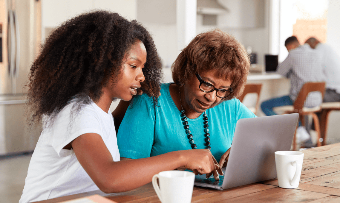 Mother and daughter using a laptop